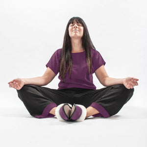 
            
                Load image into Gallery viewer, Women Wearing Plum and Black Bamboo Pajama Pants and T-Shirt Relaxing
            
        