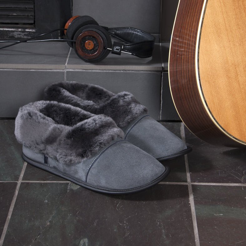 Men's Charcoal Lazybone Sheepskin Slippers on a Tile Floor