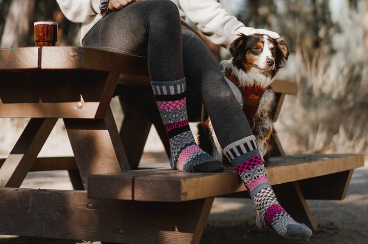 
            
                Load image into Gallery viewer, Person Wearing Solmate Wool Aspen Crew Socks with a Dog
            
        