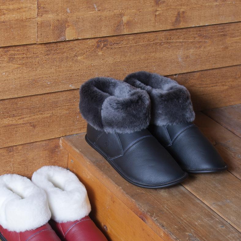 Men's Black Leather and Black Sheepskin Shin Hugger Slippers in the Stairs
